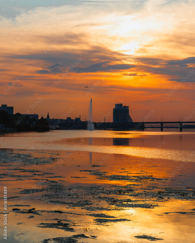 Panoramic view of the city of Dnipro during sunset or sunrise. Amazing sunset at Dnipro river with a view of the historical center. Warm days. background image. Ukrainian city. Panoramic view of the city of Dnipro during sunset or sunrise. Amazing sunset at Dnipro river with a view of the historical center. Warm days. background image. Ukrainian city.