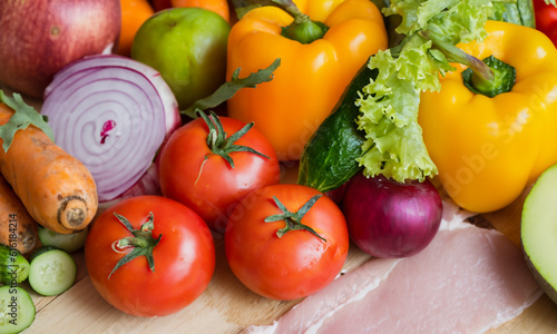 Assorted vegetables and legumes scattered on a table.