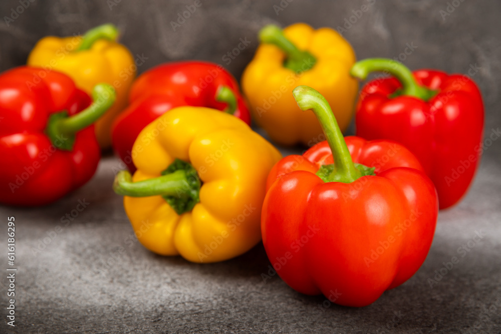 Fresh colorful red and yellow bell peppers on marble background. Bell pepper. Vegetables. Vegan food. Healthy foods. Place for text. Place to copy. Diet concept. Fresh colorful red and yellow bell peppers on marble background. Bell pepper. Vegetables. Vegan food. Healthy foods. Place for text. Place to copy. Diet concept.
