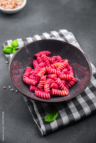 pasta fusilli beet vegetable sauce beetroot second course fresh food vegan meal food snack vegetarian food on the table copy space food background rustic top view