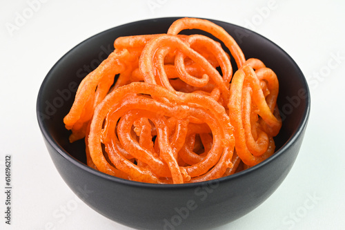 Jalebi sweet dish served in a bowl. photo