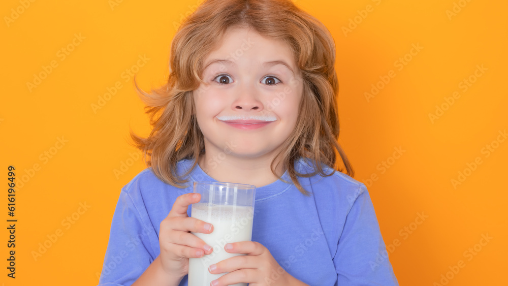 Organic milk. Little boy drinking milk. Child with glass of milk on yellow isolated background. Organic milk. Little boy drinking milk. Child with glass of milk on yellow isolated background.
