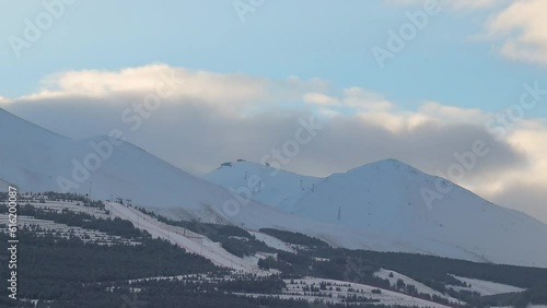 Timelapse of Palandoken Ski Resort as clouds glide over the mountain at sunrise photo