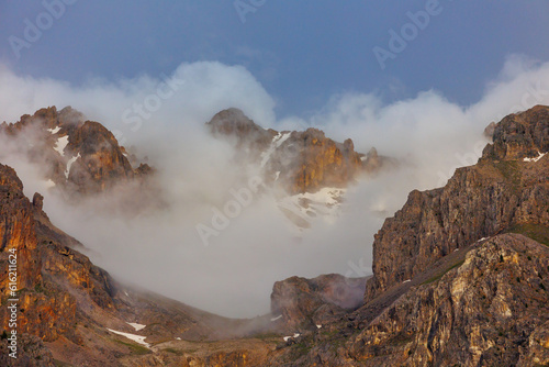 Passing clouds over a landscape in Turkey with snow capped mountains in the background. Landscape of mountain range and mountains. Dedegol. Turkey.