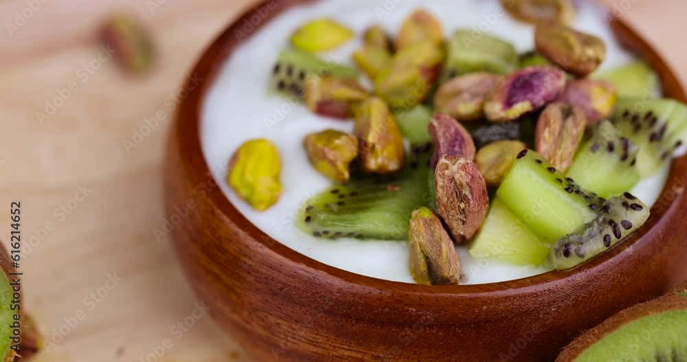 fresh green yogurt with pieces of kiwi and pistachios, fresh yogurt and kiwi with pistachios fresh green yogurt with pieces of kiwi and pistachios, fresh yogurt and kiwi with pistachios