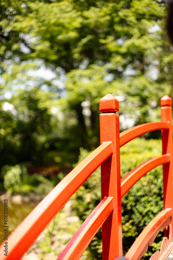 red wooden bridge in the park