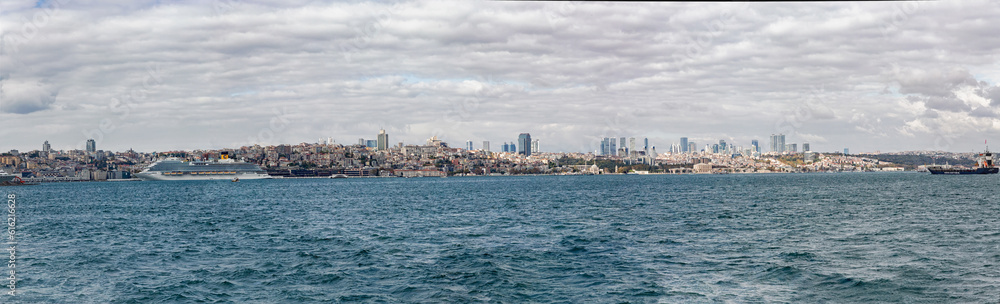 Istanbul detailed panorama as seen from Bosphorus. Beyoglu and Cihangir at skyline. Cruise liner at port. Banner. Istanbul, Turkey