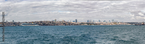 Istanbul detailed panorama as seen from Bosphorus. Beyoglu and Cihangir at skyline. Cruise liner at port. Banner. Istanbul, Turkey © Elena