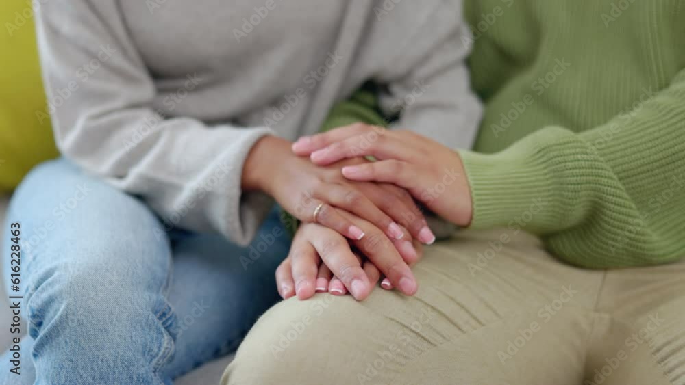 Support, couple holding hands and closeup together on a sofa for empathy. Love or sympathy, comfort or praying for healing and people at home for respect or forgive sitting on a couch for apology Support, couple holding hands and closeup together on a sofa for empathy. Love or sympathy, comfort or praying for healing and people at home for respect or forgive sitting on a couch for apology