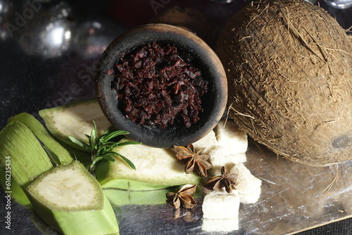 bowl of tobacco for hookah. smoking shisha. berries and fruits on a black background