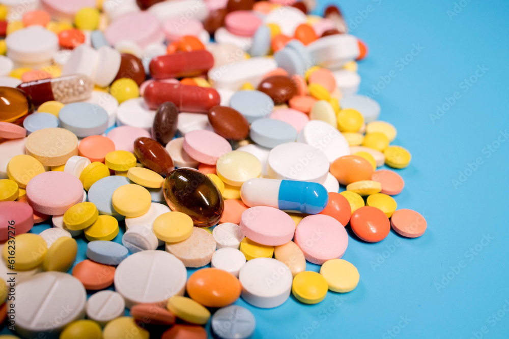 Many colorful different medicines and pills on top. The concept of medical treatment Many colorful different medicines and pills on top. The concept of medical treatment