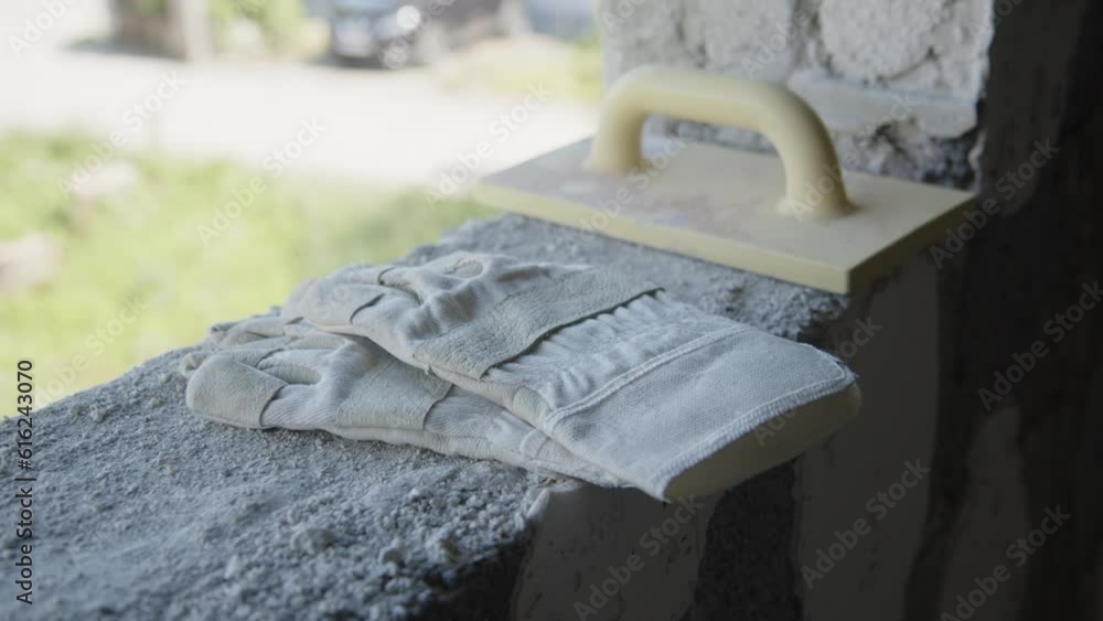 work gloves and construction tool at windowsill work gloves and construction tool at windowsill