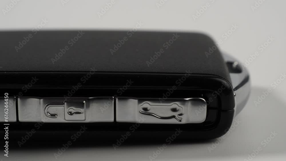 Modern wireless car key ignition on a white background. Car keys close-up. Modern wireless car key ignition on a white background. Car keys close-up.