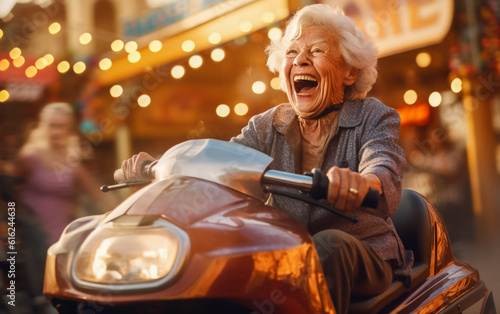 A happy elderly woman laughs and has fun on a bumper car