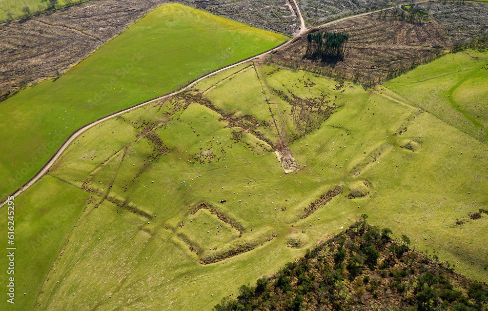 Above Burnswark Iron Age hillfort near Lockerbie, Scottish Borders, showing the southern flank Roman siege camp ramparts and 3 ballista platforms