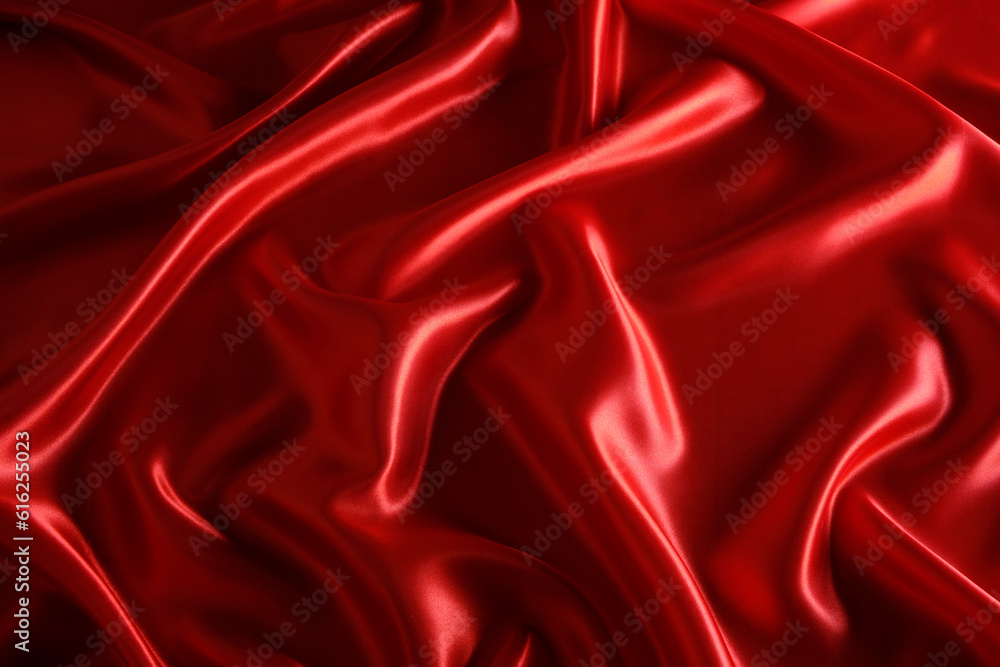 Obraz premium Abstract background made of red silk wavy fabric.