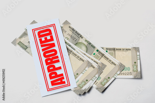 Bank Loan Concept: Indian 500 Rupee Notes with Approval Stamp on White Background, Space for Your Text