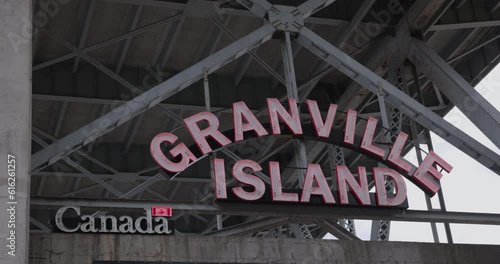 Vancouver, B.C Canada - April 13th 2023 - Granville island sign under bridge photo