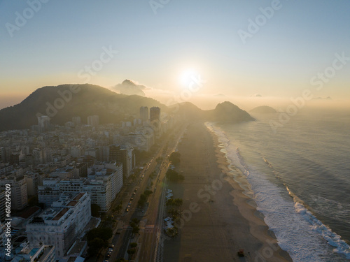 City shrouded in the haze of dawn. Aerial view of Rio de Janeiro, Copacabana beach. Skyscrapers beaches and nature. Sidewalks and streets. Sugarloaf wrapped in clouds, 06-06-2023. Brazil 