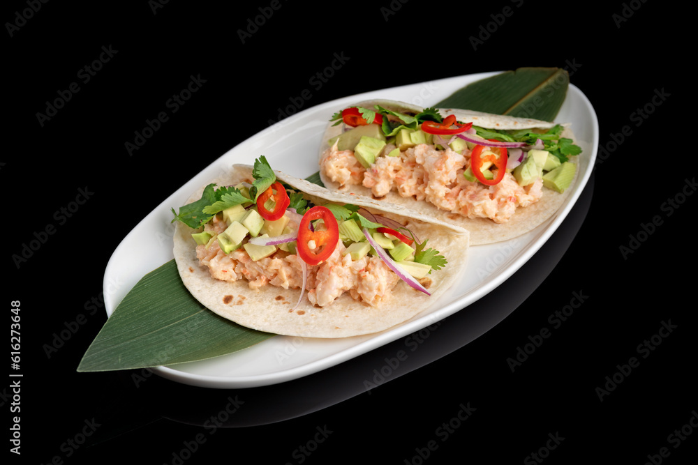 Delicious raw shrimps tartare on white plate a black background. menu restaurant Delicious raw shrimps tartare on white plate a black background. menu restaurant