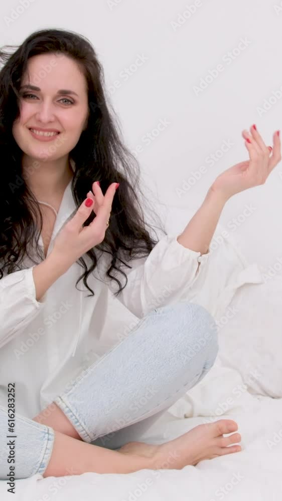 Excited young woman holding her palm open for new product presentation or sale. Overjoyed happy brunette woman with open mouth showing finger on hand with copy space for promotion isolated Excited young woman holding her palm open for new product presentation or sale. Overjoyed happy brunette woman with open mouth showing finger on hand with copy space for promotion isolated