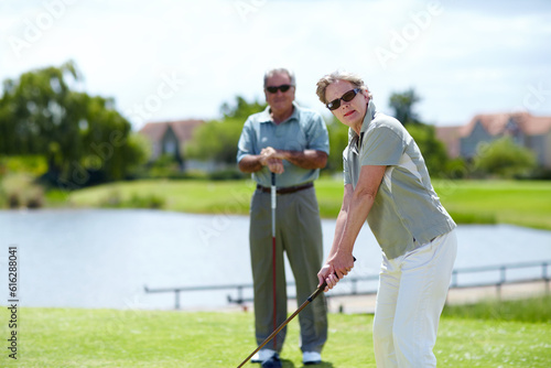 Mature, woman or portrait of golfer on golf course for fitness, workout or stroke exercise in retirement. Senior couple, sunglasses or serious lady training in golfing sports game driving with a club