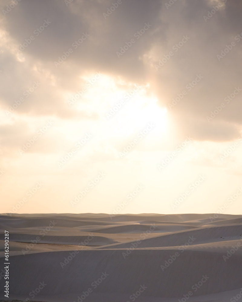 Sunrise over the tranquil Zahek Dunes in Socotra, Yemen, with soft light illuminating the sand. Sunrise over the tranquil Zahek Dunes in Socotra, Yemen, with soft light illuminating the sand.