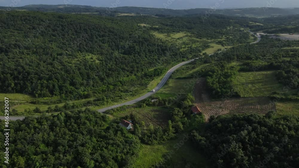 Aerial Drone View Car Driving on Curvy Mountain asphalt Road in summer Aerial Drone View Car Driving on Curvy Mountain asphalt Road in summer