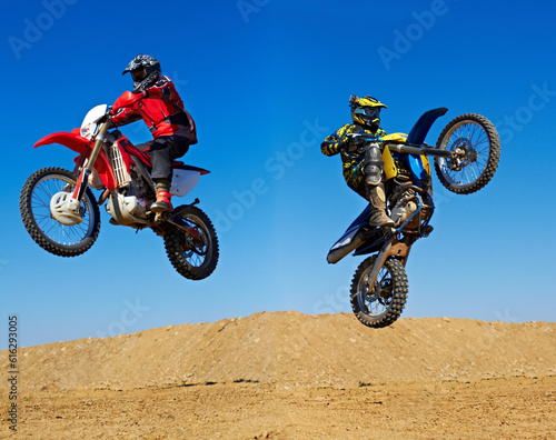 Motorcycle jump, sport and action with stunt and energy on off road track, transportation and people race outdoor. Competition, dirt bike and performance with adrenaline, exercise and challenge