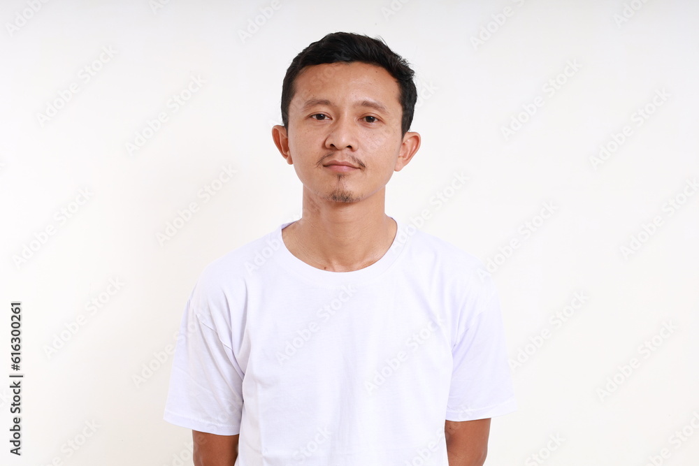 Asian funny man standing against white background Asian funny man standing against white background