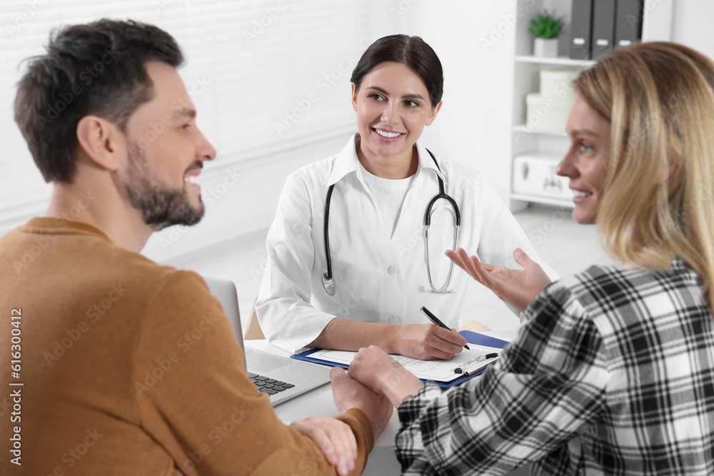 Couple having appointment with fertility doctor in clinic. Patient consultation Couple having appointment with fertility doctor in clinic. Patient consultation