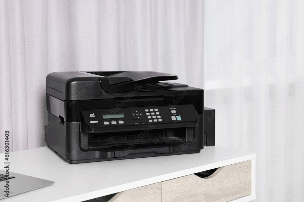 Modern printer with paper on white desk at home Modern printer with paper on white desk at home