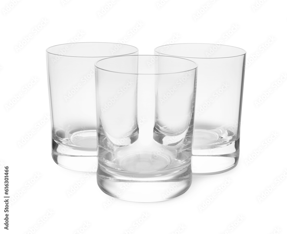 Elegant clean empty shot glasses isolated on white Elegant clean empty shot glasses isolated on white