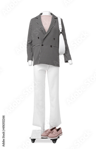 Female mannequin with bag dressed in stylish jacket, sweater and pants isolated on white