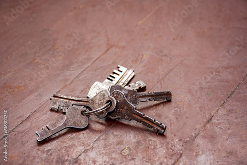 22nd June, 2022, Kolkata, India: Keys on key ring on a wooden background