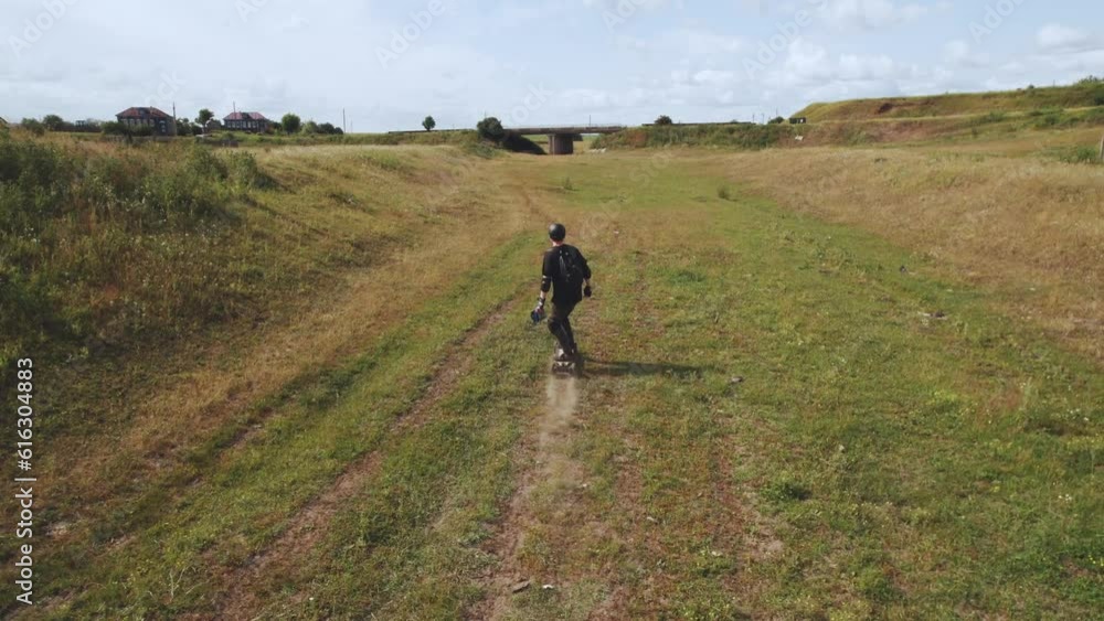 Aerial photography of a skateboarder in nature, a man on an electric skateboard, riding an electric skateboard in nature, electric longboard evolve, electric skateboard evolve Aerial photography of a skateboarder in nature, a man on an electric skateboard, riding an electric skateboard in nature, electric longboard evolve, electric skateboard evolve