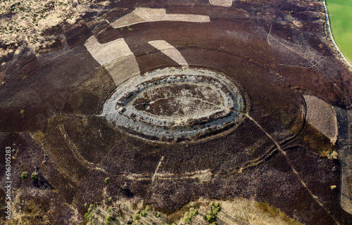 White Caterthun. Vitrified dry stone wall prehistoric hillfort possibly Pictish on earlier Bronze or Iron Age occupation site. Aerial. N. at 2 o’clock photo