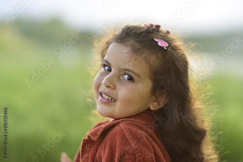 little girl playing and having fun by the river