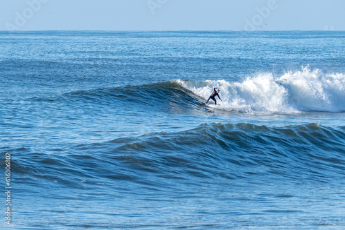 Man surfing atlantic ocean waves