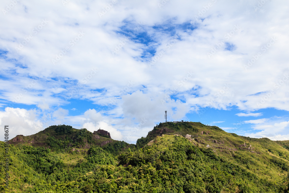 Green mountains and beautiful cloudy sky under blue sky.