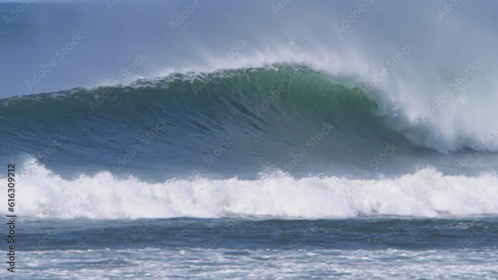 Title: Barreling empty wave, great for surfing, pacific coast of Costa Rica, in Ostional, in the summertime, blue water, offshore winds, HD Title: Barreling empty wave, great for surfing, pacific coast of Costa Rica, in Ostional, in the summertime, blue water, offshore winds, HD