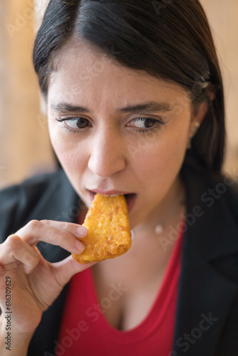 detail of fried food  young woman with black hair having lunch  modern lifestyle in studio  delicious food  hunger