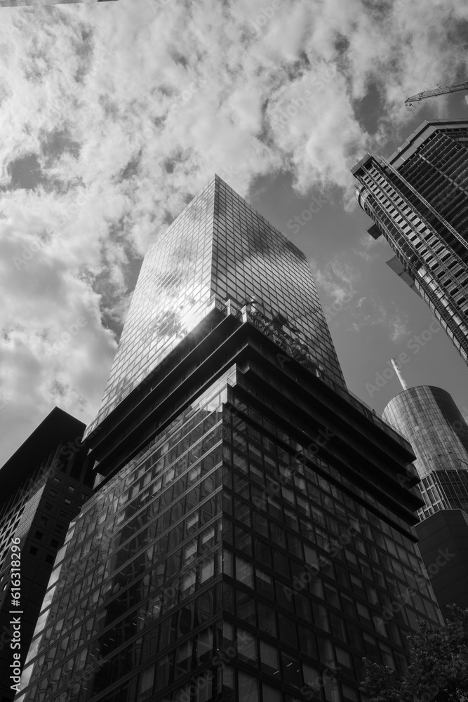 Black and white tone dramatic sky, Low angle view of modern skyscrapers, High rise building in downtown district of Frankfurt, Germany. 