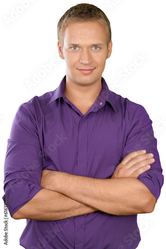 Causually dressed male with his arms crossed