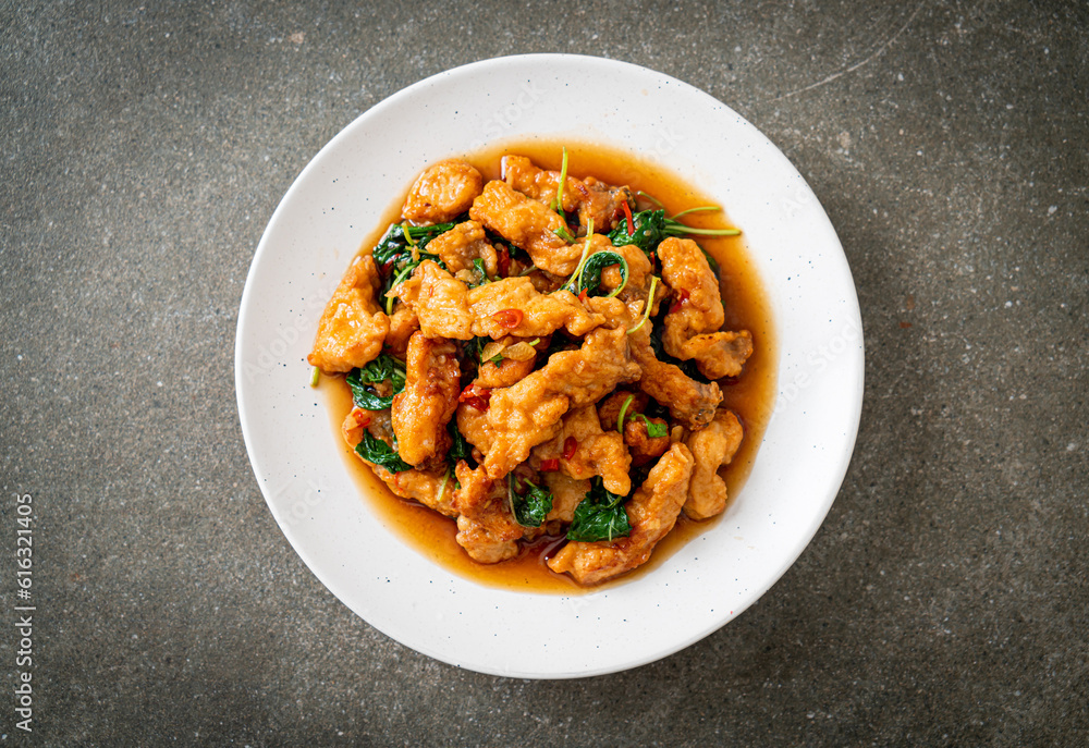 stir-fried fried fish with basil and chili in thai style stir-fried fried fish with basil and chili in thai style