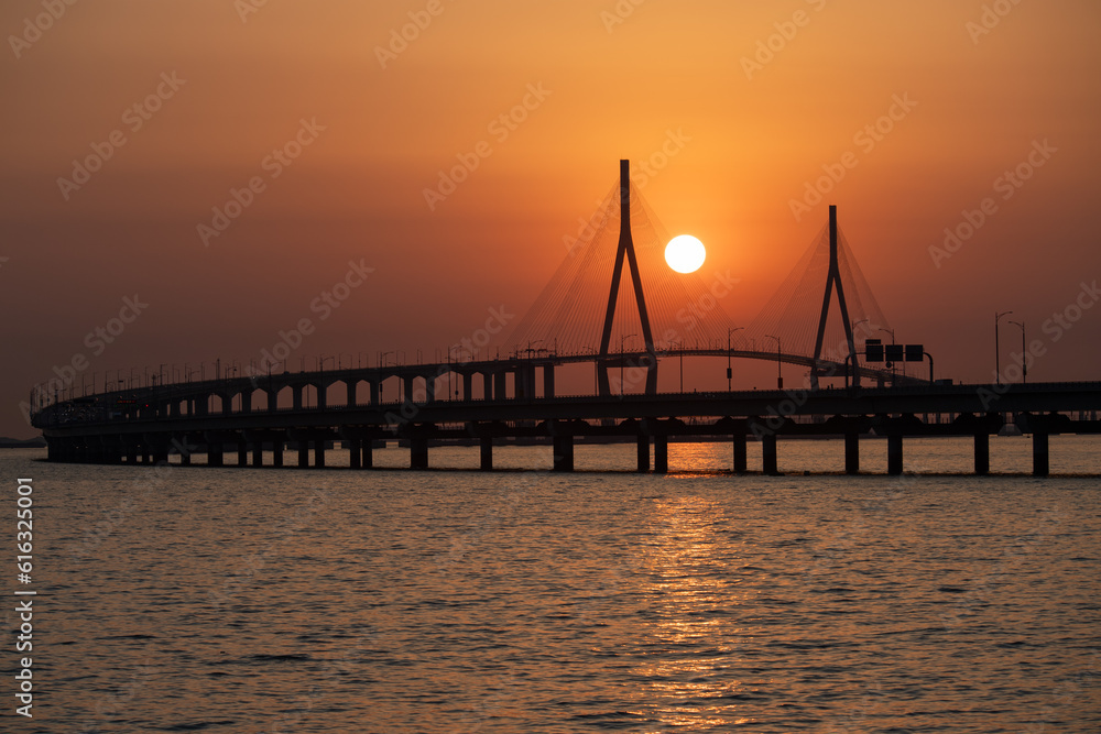 bridge and sunset over the sea
