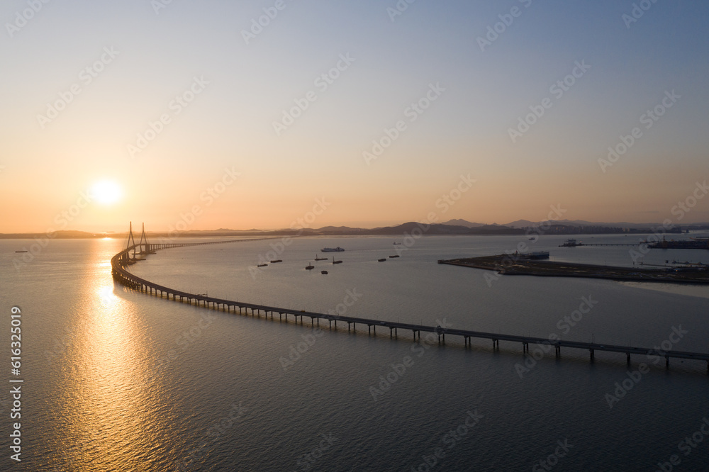 bridge and sunset over the sea
