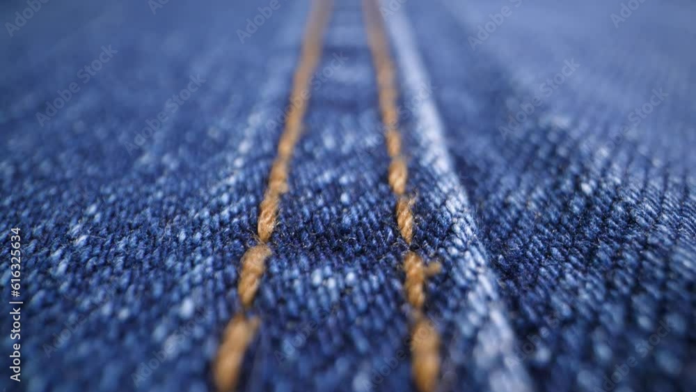The structure of the fabric. Close-up of blue denim fabric. Dolly shot The structure of the fabric. Close-up of blue denim fabric. Dolly shot