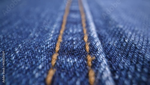 The structure of the fabric. Close-up of blue denim fabric. Dolly shot