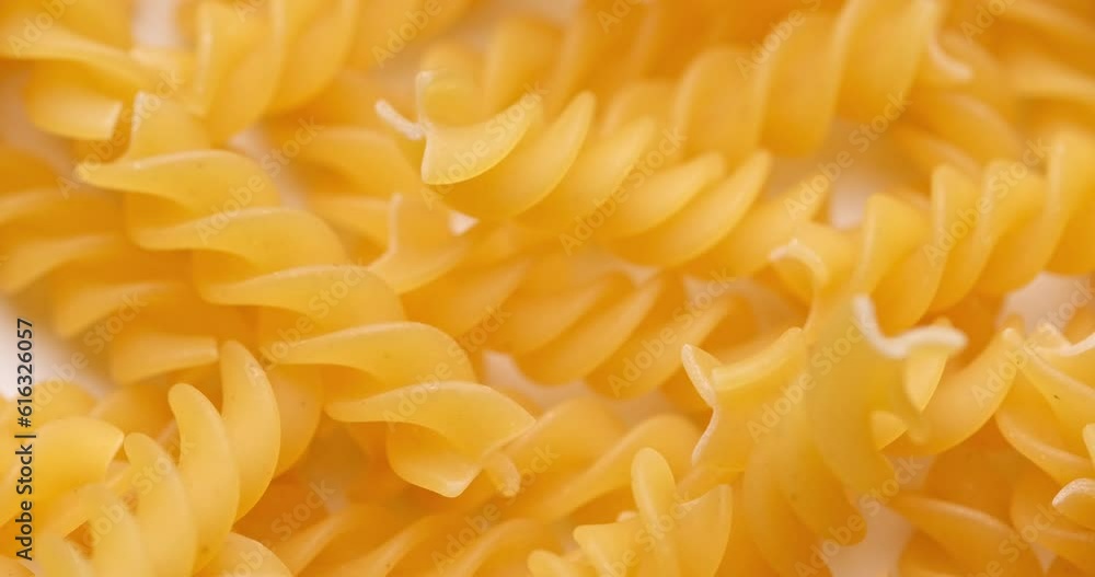 pasta backgroud - macro view of Dry Authentic Italian fusilli pasta backgroud - macro view of Dry Authentic Italian fusilli